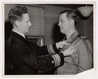 Commander Leon H. Morine Receives Navy Commendation Ribbon