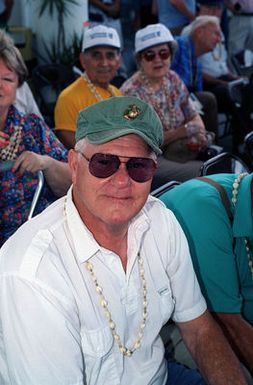 Paul Dotur from Senora, California sits in the audience as part of the 50th Anniversary Ceremony of the Liberation of Guam during World War II. He served with the First Amphibious Assault Battalion