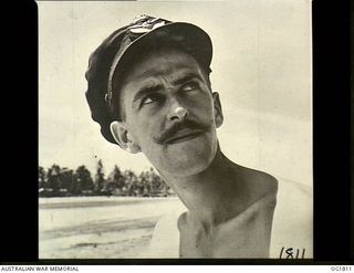 MOMOTE, LOS NEGROS ISLAND, ADMIRALTY ISLANDS. C. 1944-04. PORTRAIT OF A TYPICAL AUSSIE FLYER, FLIGHT LIEUTENANT JIM HARRISON OF MELBOURNE, VIC, WHO CAME TO THE RAAF FROM THE ARMY AND IS A PILOT ..