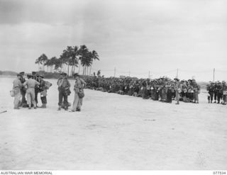 TOROKINA AREA, BOUGAINVILLE ISLAND. 1944-12-12. TROOPS OF THE 12TH ADVANCED WORKSHOPS ON PARADE BEFORE TRANSFER TO THE DETAILS CAMP