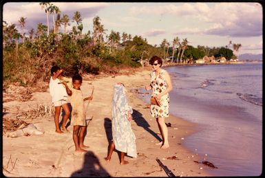 Talking to children on the beach, 1971