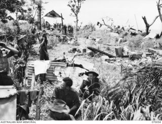 4th Infantry Battalion Headquarters on high ground standing on the site of the Sio Mission which is now destroyed. ‘Doovers’ in which officers and men shelter are constructed using any available ..