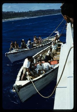 Mangaian flat-bottomed tenders alongside HMNZS Endeavour, Mangaia, Cook Islands