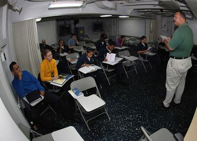 U.S. Navy Sailors listen intently to their instructor during History 1301, a Naval College Program for Afloat College Education course, onboard the Tarawa Class Amphibious Assault Ship USS SAIPAN (LHA 2) while the ship is underway in the Indian Ocean on Aug. 22, 2006. The program gives Sailors the opportunity to experience challenging education and continue their personal and professional growth while on sea duty assignments. (U.S. Navy photo by Mass Communication SPECIALIST Third Class Erik K. Siegel) (Released)