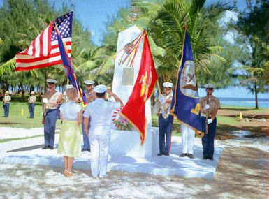 Mrs. Jean Witek, left, participates in a wreath of Honor Monument dedication ceremony. The monument was erected to honor four Marines for heroism during World War II. They are Captain Louis Wilson, Jr., Private First Class (PFC) Leonard Mason, PFC Luther Skaggs and PFC Frank Witek. (Substandard image)