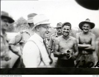 AITAPE, NORTH EAST NEW GUINEA. C. 1944-06. ARTHUR DRAKEFORD, THE MINISTER FOR AIR, TALKING TO RAAF PERSONNEL DURING HIS VISIT TO RAAF UNITS IN THE NEW GUINEA AREA