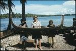 Frances Harwood with two men and miniature canoe