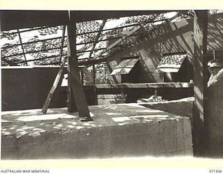 PORT MORESBY, PAPUA, NEW GUINEA. 1944-03-27. THE BOOM SECTION GUN EMPLACEMENT AT THE PAGA BATTERY, COAST ARTILLERY SHOWING THE CANTILEVER CAMOUFLAGE COVERING OF THE EMPLACEMENT