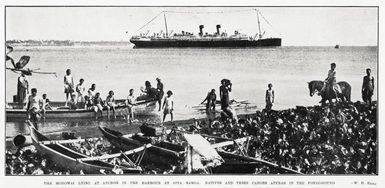 The Monowai lying at anchor in the harbour at Apia, Samoa. Natives and their canoes appear in the foreground