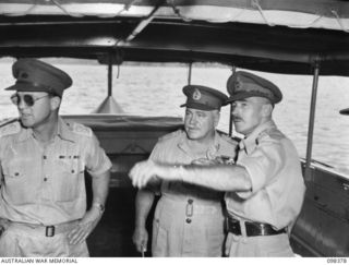 RABAUL, NEW BRITAIN. 1945-10-27. MAJOR GENERAL K.W. EATHER, GENERAL OFFICER COMMANDING 11 DIVISION (3) POINTING OUT SHORE INSTALLATIONS TO GENERAL SIR THOMAS A. BLAMEY, COMMANDER-IN-CHIEF, ALLIED ..