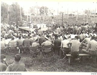 MADANG, NEW GUINEA. 1944-09-16. A SECTION OF THE CROWD, ESTIMATED AT 5000, GATHERED EARLY FOR THE BOXING AND WRESTLING TOURNAMNET AT THE 165TH GENERAL TRANSPORT COMPANY BETWEEN MEMBERS OF THE RAN, ..