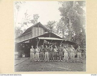 LAE, NEW GUINEA. 1944-09-27. PERSONNEL OF THE 3RD SIGNAL SECTION ATTACHED TO THE 43RD FORWARD ORDNANCE DEPOT. IDENTIFIED PERSONNEL ARE:- SIGNALMAN E R JACOBS (1); SERGEANT R GEARON (2); SIGNALMAN R ..