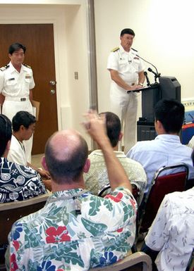 US Navy (USN) Rear Admiral (RADM) William R. Klemm (at podium), Project Coordinator for the Ehime Maru Recovery Operations answers questions during a media briefing at the Ehime Maru Media Center, Pearl Harbor, Hawaii (HI)