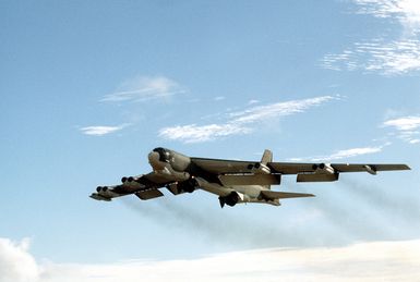 A left underside view of a B-52G Stratofortress aircraft of the 43rd Strategic Wing taking off during Theater Force Employment Exercise IV