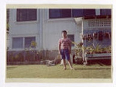 Brian Takamori standing in backyard