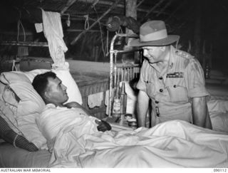 AITAPE, NEW GUINEA. 1945-03-20. GENERAL SIR THOMAS A. BLAMEY, COMMANDER-IN-CHIEF, ALLIED LAND FORCES, SOUTH WEST PACIFIC AREA (1), TALKING TO LANCE-CORPORAL E.A. BAKER, 2/7 INFANTRY BATTALION (2), ..