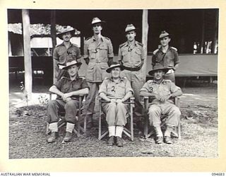 YALU, NEW GUINEA. 1945-08-03. OFFICER INSTRUCTORS AT THE NEW GUINEA TRAINING SCHOOL. IDENTIFIED PERSONNEL ARE:- CAPTAIN J.A. SHIMELD (1); MAJOR V.E. DOWDY (2); CAPTAIN C.W. YOUNG (3); LIEUTENANT ..