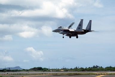 A left side view of an F-15 Eagle aircraft from the 21st Tactical Fighter Wing, as it approaches to land during Exercise OPPORTUNE JOURNEY 84
