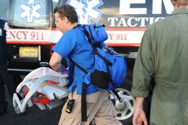 Earthquake ^ Tsunami - Pago Pago, American Samoa, October 5, 2009 -- A member of a Disaster Medical Assistance Team (DMAT) rushes supplies onto an awaiting Coast Guard plane that will evacuate an infant to Hawaii. DMATs are part of the U. S. Department of Health and Human Services' National Disaster Medical System which supports hospitals and other medical and public health needs of communities during disasters such as the earthquake and tsunami disaster in American Samoa. FEMA/Casey Deshong