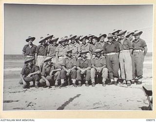 BORAM, NEW GUINEA. 1945-11-21. INFORMAL GROUP PORTRAIT OF OFFICERS AND MEN OF B COMPANY, 30TH INFANTRY BATTALION