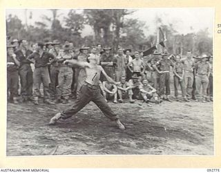 SORAKEN, BOUGAINVILLE. 1945-06-03. CORPORAL W.B. BERTRAM, 16 FIELD COMPANY WHO WON THE THROWING THE CRICKET BALL EVENT DURING A SPORTS CARNIVAL AT HEADQUARTERS 11 INFANTRY BRIGADE