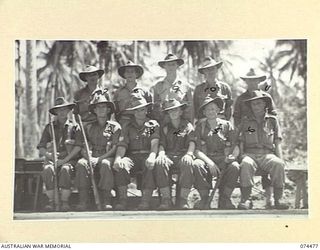 MADANG, NEW GUINEA. 1944-07-03. THE STAFF MEMBERS OF BATTALION HEADQUARTERS ORDERLY ROOM, 24TH INFANTRY BATTALION. IDENTIFIED PERSONNEL ARE:- CORPORAL SMITH (1); CORPORAL D. FISK (2); SERGEANT W. ..