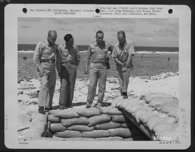 7Th Air Force Commanders Look Over Brig. General Truman H. Landon'S Foxhole On Kwajalein, Marshall Islands. They Are, Left To Right: Brig. General Walter J. Reed, Brig. General Ernest M. Moore, Brig. General Robert W. Douglass, Jr., And Brig. General Land (U.S. Air Force Number 65381AC)
