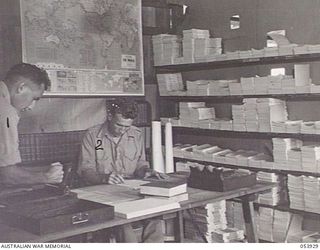 PORT MORESBY, NEW GUINEA. 1943-07-13. RESEARCH AND STUDY ROOM AT THE PORT MORESBY AREA EDUCATION CENTRE, AUSTRALIAN ARMY EDUCATION SERVICE. LEFT TO RIGHT: NX94010 SERGEANT L. F. MILLER, RESEARCH ..