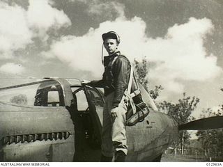 2nd Lieutenant Ivan A. Humphrey of Fleischmanns, New York, serving with the United States Air Force. He is seen here standing on the wing of his P39 Bell Airacobra fighter aircraft