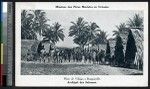 Missionaries pose with men in a village, Papua New Guinea, ca.1900-1930