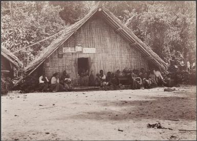 Women and children listening to addresses at the church congress, Honggo, Solomon Islands, 1906 / J.W. Beattie