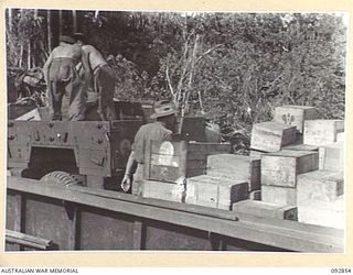 NANTAMBU, NEW BRITAIN, 1945-06. STORES FOR FORWARD TROOPS AT WATU POINT AND MAVELO PLANTATION BEING LOADED INTO BARGES