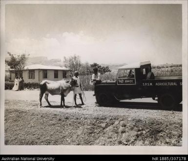 Field Officer speaking with Indian farmer