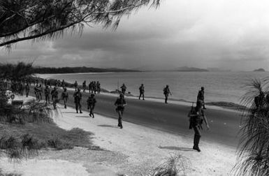 Soldiers from Schofield Barracks pass a beach during their road march around the island to commemorate Army Recognition Week, June 14-19, 1982