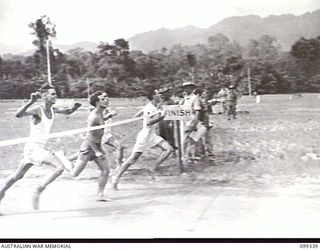 TOROKINA, BOUGAINVILLE, 1945-12-05. PRIVATE K. P. BREENAN, 15TH INFANTRY BATTALION WINNING THE 220 YARDS INAL IN 26 SECONDS AT THE 3 DIVISION AMENITIES ATHLETIC CARNIVAL HELD AT GLOUCESTER OVAL