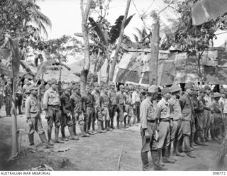 RABAUL, NEW BRITAIN. 1945-11-11. 5. AN IDENTIFICATION PARADE OF SUSPECTED JAPANESE WAR CRIMINALS WAS ARRANGED BY THE WAR CRIMES COMMISSION, AT HEADQUARTERS 11 DIVISION. SHOWN, JAPANESE TROOPS LINED ..