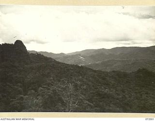 IMITA, NEW GUINEA. 1944-04-30. VIEWING NORTH FROM THE CREST OF THE INITA RIDGE FOLLOWING THE 23 LINE SECTION OF THE 18TH AUSTRALIAN LINES OF COMMUNICATION SIGNALS, BETWEEN KOKODA AND ILOLO