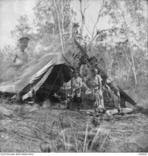 PAPUA. 1942-10. PRESS CORRESPONDENTS OUTSIDE THEIR TENT IN THE FORWARD AREA OF NEW GUINEA