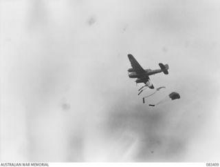 BABIANG AREA, NEW GUINEA, 1944-11-19. A BEAUFORT BOMBER OF 7 SQUADRON, RAAF, SUPPLY DROPPING TO TROOPS OF 2/10 COMMANDO SQUADRON