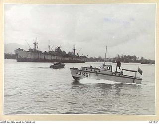 PURUATA ISLAND, SOUTH BOUGAINVILLE. 1945-05-29. A FAST SUPPLY BOAT (CONTROL LAUNCH), MEASURING 38 FEET, MOVES THROUGH THE 42 LANDING CRAFT COMPANY AREA. IT IS POWERED BY 2 CHRYSLER 6 MARINE ENGINES ..