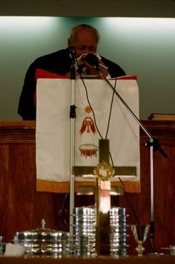 King Taufa'ahau Tupou IV speaking from the pulpit at the dedication of Vaine Mo'onia (The True Vine) church