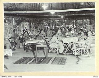 EGGY'S CORNER, PORT MORESBY, PAPUA, 1944-02-20. MEMBERS OF THE AUSTRALIAN ARMY NURSING SERVICE RELAXING IN THE SISTERS' MESS AT THE 2/1ST GENERAL HOSPITAL. IDENTIFIED PERSONNEL ARE: WFX34457 SISTER ..