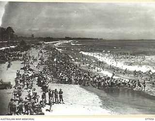 TOROKINA, BOUGAINVILLE, 1944-11-19. TOROKINA BEACH FROM THE LOOK-OUT TOWER SHOWING THE CROWD WHICH ATTENDED THE SURF CARNIVAL ORGANISED BY THE 3RD DIVISION