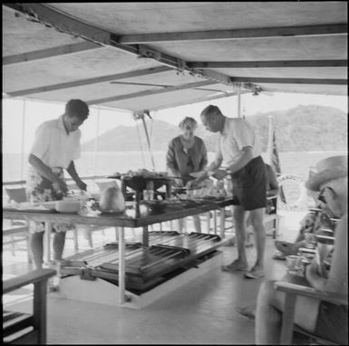 Tourists having lunch on board a ship, Vanua Levu, Fiji, November 1966 / Michael Terry