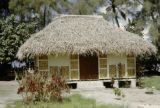 French Polynesia, thatched-roofed cottage on Tahiti Island