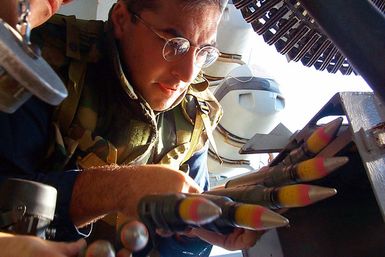 Aviation Maintenance Administrationman 2nd Class (AZ2) Garcia of Island Park, New York, loads a Close In Weapons System (CIWS) mount with 20mm ammunition during a general quarters drill aboard the amphibious assault ship USS SAIPAN (LHA 2)