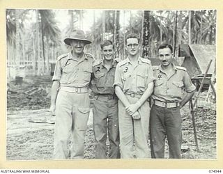 FINSCHHAFEN, NEW GUINEA. 1944-07-31. OFFICERS OF THE FINSCHHAFEN DETACHMENT OF THE 19TH LINES OF COMMUNICATION SIGNALS. IDENTIFIED PERSONNEL ARE:- NX142659 MAJOR E.S. COX, OFFICER IN CHARGE, NO. 2 ..