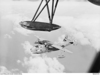 Qld. 1944-09-21. A Martin PBM Mariner flying boat aircraft seen from another aircraft at 9000 feet while flying from Cairns to Port Moresby, New Guinea. The type, used as long-range patrol bombers ..
