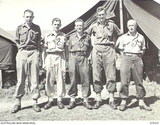 BULOLO, NEW GUINEA. 1944-07. PERSONNEL OF "G" SECTION HEADQUARTERS, 11TH DIVISION. IDENTIFIED PERSONNEL ARE:- PRIVATE S. BILLIAU (1); STAFF SERGEANT T.W. ROSSITER (2); WARRANT OFFICER I, L.C. ..