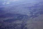 Aerial view of Asaro Valley, E[astern] Highlands, showing a European coffee plantation, [Papua New Guinea, 1963?]